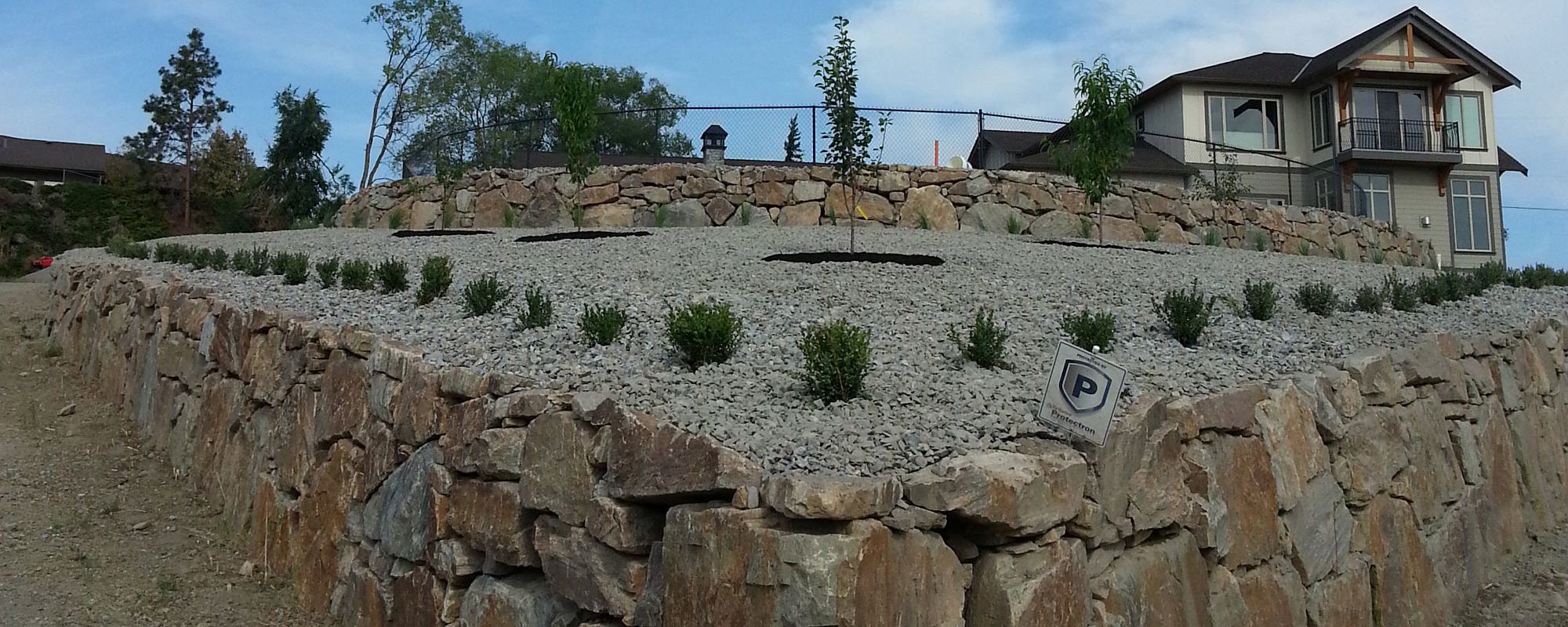 Kettle Valley Granite Rock Wall & Formal Planting, West Kelowna