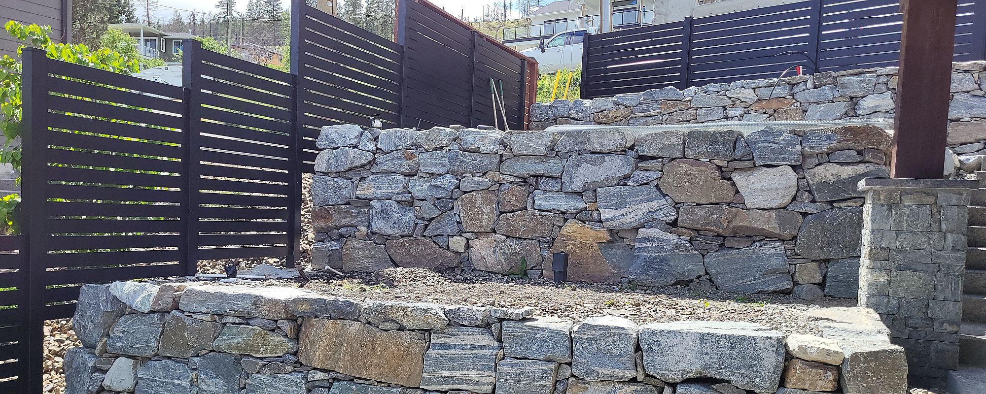 Kettle Valley Granite Tiered Rock Walls, Fintry B.C., Green & Grey Landscaping Inc.